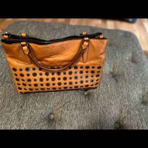Coach leather grommet hand bag